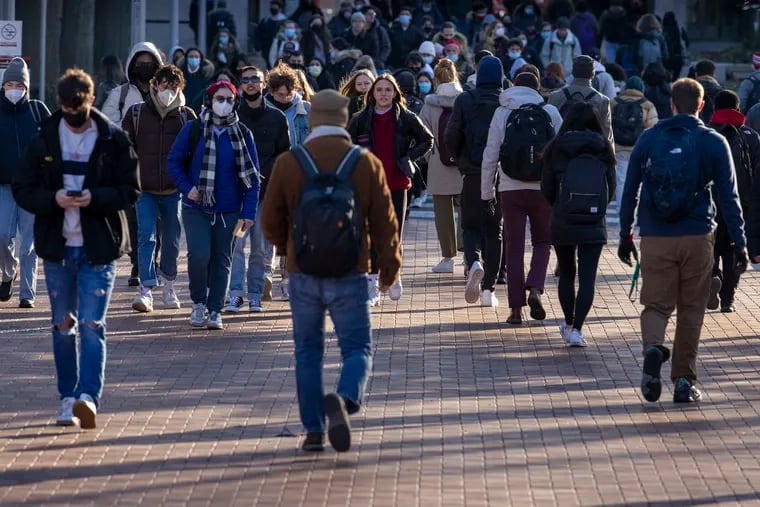 Students at Temple University walking along Polett Walk in January.