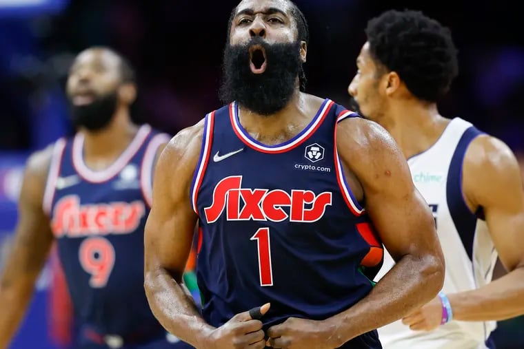 Sixers guard James Harden yells after making a fourth quarter three-point basket against the Dallas Mavericks on Friday.