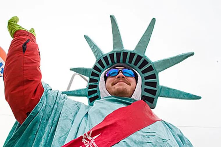 Jonathan Adels, 32, of Westville, who lost his job a year ago, is earning income as a Statue of Liberty garbed waver for Liberty Tax Service.