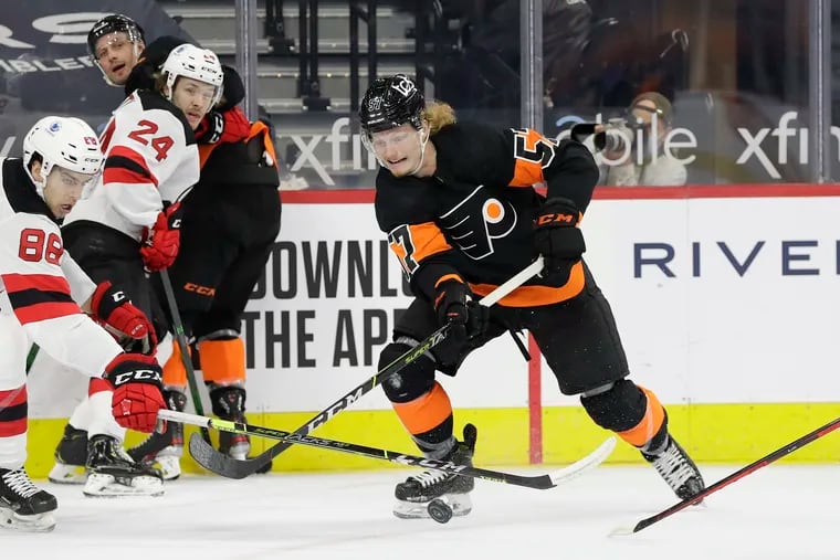 Flyers right winger Wade Allison skates after the puck against New Jersey Devils defenseman Kevin Bahl in a game on May 1.