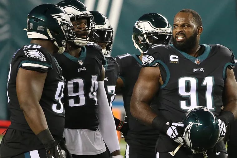 Fletcher Cox (right) says the Eagles don't have much to brag about at 2-4-1.
