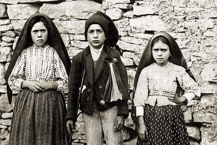 Lucia dos Santos, 10, (left) and her cousins Francisco Marto, 9, (center) and his 7 year-old sister Jacinta, who reported seeing apparitions of the Virgin Mary in Fatima, Portugal, in 1917.