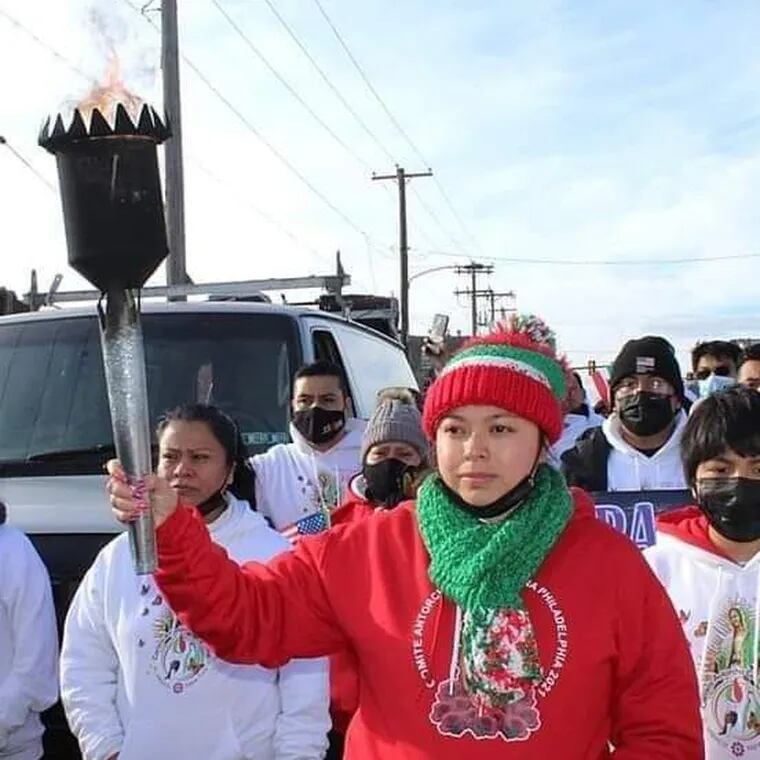 Ana Line Ceron Hernández, (in red) during the Guadalupe Torch run in Philadelphia in 2021.