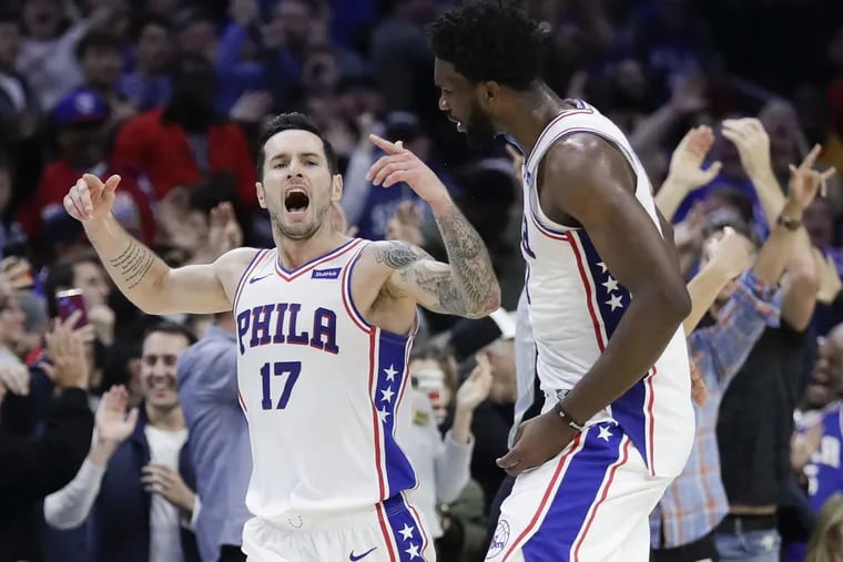 Sixers guard JJ Redick celebrates his game winning three point basket with teammate center Joel Embiid late in the fourth-quarter against the Orlando Magic on Saturday, October 20, 2018 in Philadelphia.