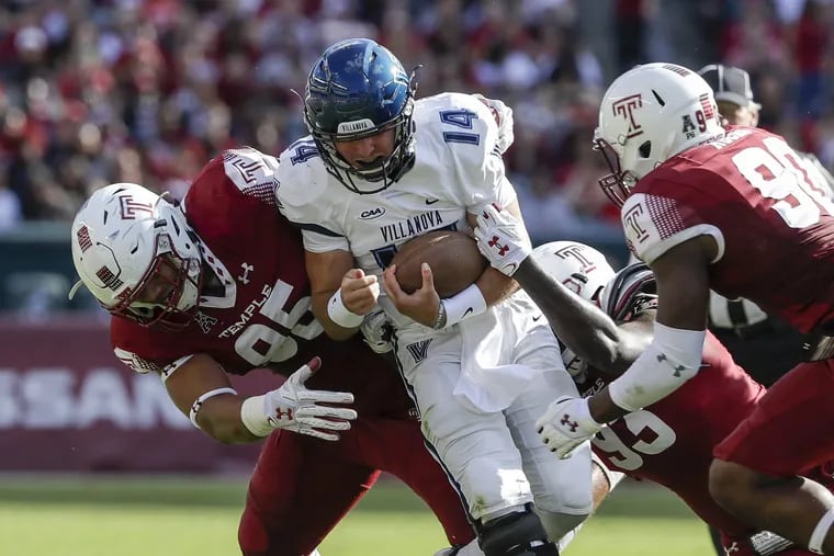 Villanova quarterback Zach Bednarczyk gets sacked by Temple defensive lineman Dan Archibong and others in 2017.