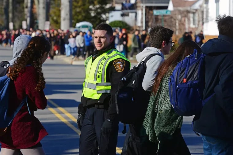 Students return to classes at Tenafly High in Bergen County, N.J., one of the more than 50 schools in at least six states that were the targets of attack threats last week. While such threats almost always prove false, educators say they cannot take chances.