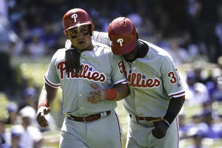 Philadelphia Phillies\' Carlos Ruiz, left, celebrates with Odubel Herrera during a game against the Los Angeles Dodgers earlier this month. The Philadelphia Phillies won 6-2.