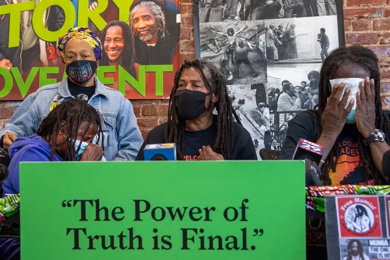 From left, family members of MOVE, Pam Africa, Janet Africa, Janine Africa, and Consuewella Africa, speak during a press conference to denounce how two museums have handled the remains of a group member who died in the 1985 city bombing of their West Philly compound. Monday, April 26, 2021.