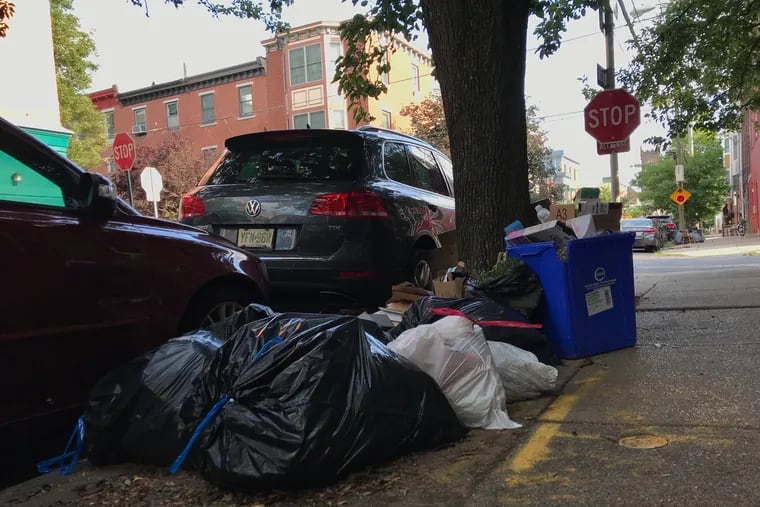 Trash waiting to be collected at 21st and Fitzwater Streets in Philadelphia on July 16. Trash and recycling pick up has been very delayed for Philadelphians due to the impact of COVID-19.