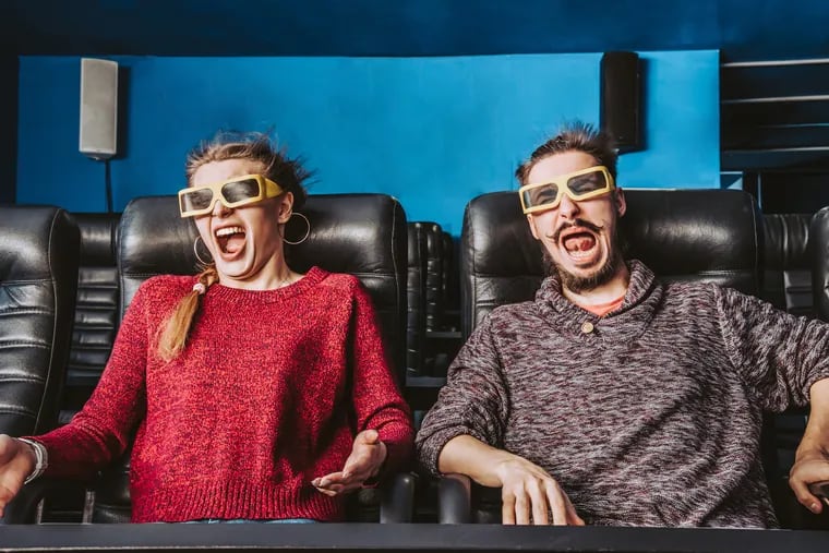 A couple watches a 4D movie.