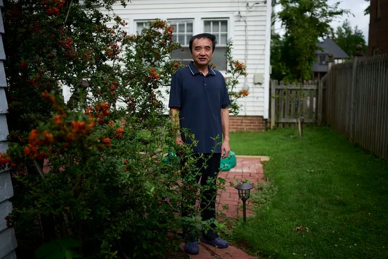 Qing Wang, who was accused of hiding ties to a Chinese university while securing U.S. research grants, says he "was shocked" when he was arrested in May 2020. Justice officials dismissed charges this month. Wang is photographed at home in Cleveland on Aug. 18, 2021. Photo for The Washington Post by Dustin Franz