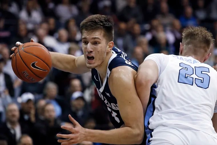 Filip Petrusev (left) looks to impress the Sixers to this summer.