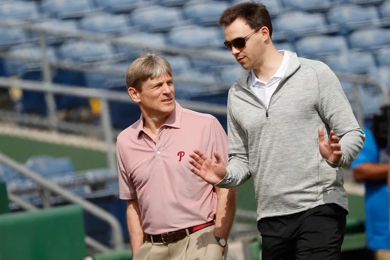 Phillies GM Matt Klentak, right, can offer advice to managing partner John Middleton, but the owner must decide if he wants to spend more than $300 million on either Bryce Harper or Manny Machado.