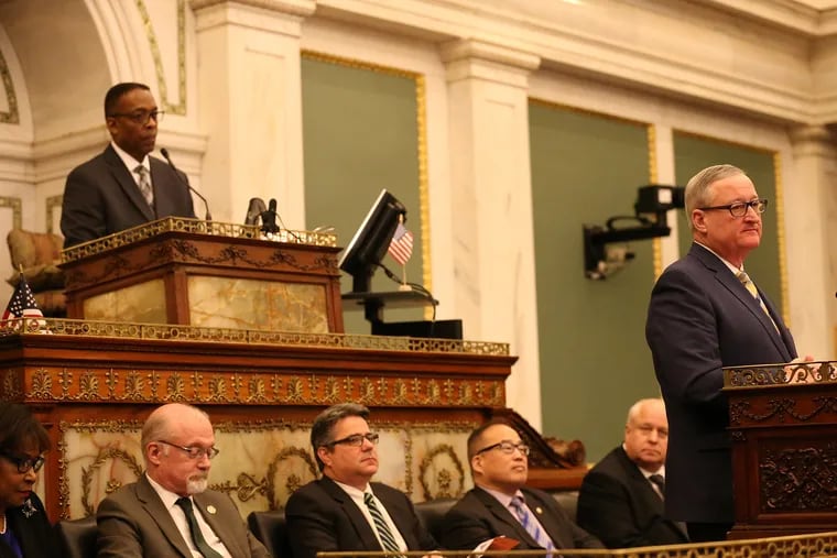 Mayor James Kenney, right, pauses as he makes his budget address to City Council in Philadelphia, PA on March 7, 2019.