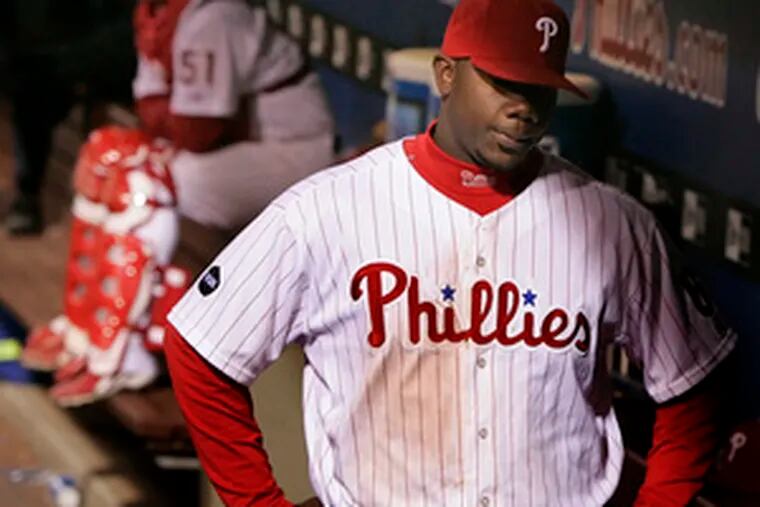 A disappointed Ryan Howard walks into the dugout afer making the last out of the game. Howard and the Phillies&#0039; offense continued to struggle in the clutch, leaving 12 runners on base last night. They also hit into three double plays.
