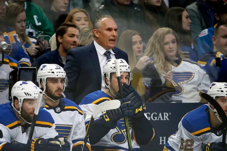 St. Louis Blues interim coach Craig Berube watching his team play the Dallas Stars earlier this season. Berube turned around the team after being hired early in the season.