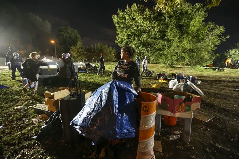 The Ridge Avenue encampment is breaking down. Luna Evans 27, center,  has spent 3.5 months living between both encampments. She said arrangements for housing are being made for her.