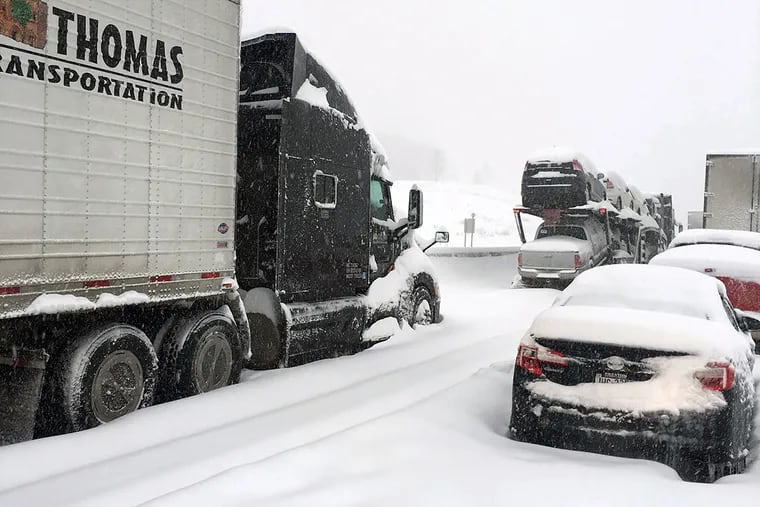 Traffic is at a standstill on the Pennsylvania Turnpike near Bedford, Pa., Saturday, Jan. 23, 2016.