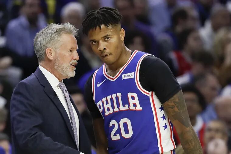 It might make sense for Brett Brown (left) to play Markelle Fultz more to allow Ben Simmons time to recover.