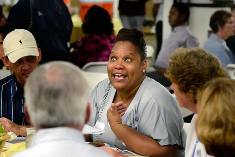 Angela “Nike” Sutton shares her experiences in stretching a disability check to feed her family. About 180 people, including city leaders and activists, attended the event at the SHARE Food Program’s offices. (TOM GRALISH/Staff Photographer)