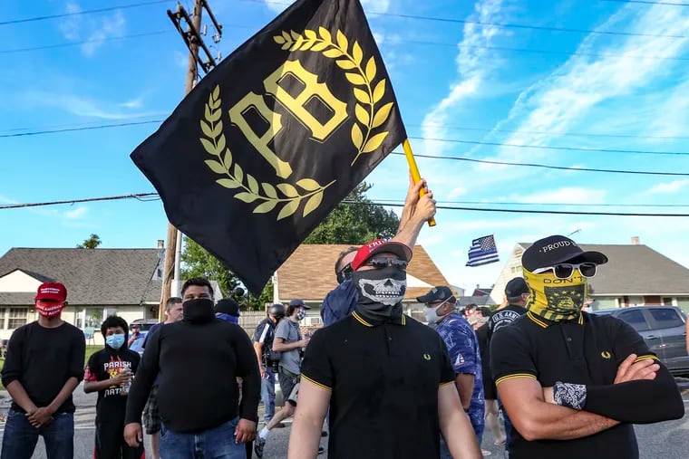 A group of roughly 10 men who identified themselves as members of the Proud Boys stood outside the Northeast Philadelphia headquarters of Lodge 5 of the Fraternal Order of Police on Thursday during a visit from Vice President Mike Pence.