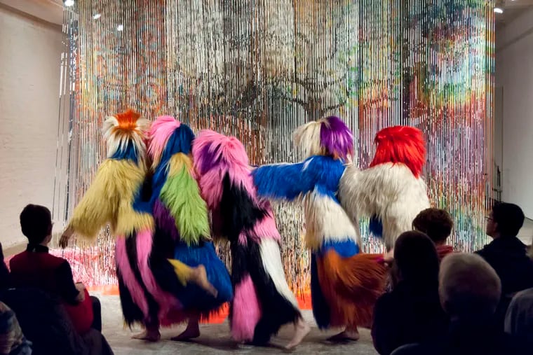 &quot;Architectural Forest&quot; opened Nick Cave's exhibition at Fabric Workshop and Museum with dancers and musicians in an environment of shimmering bands of painted bamboo.
