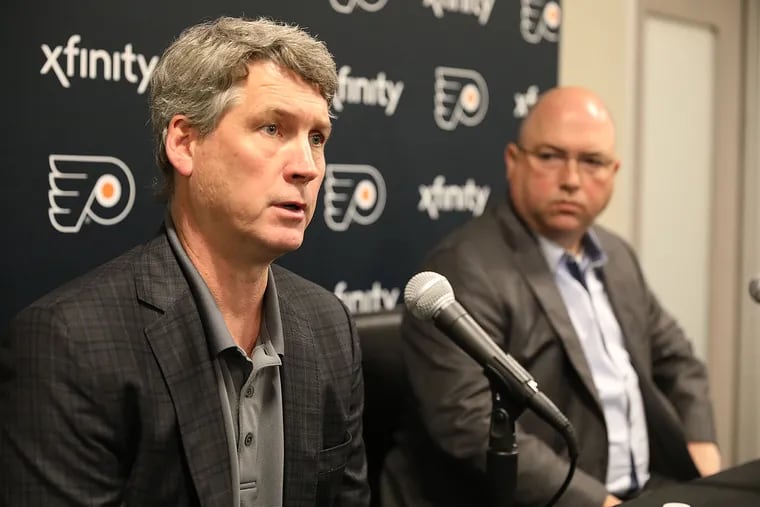 Flyers general manager Chuck Fletcher (left) and assistant GM Brent Flahr will probably pick around 13th in the NHL draft ... unless they get lucky in the June 2 lottery.