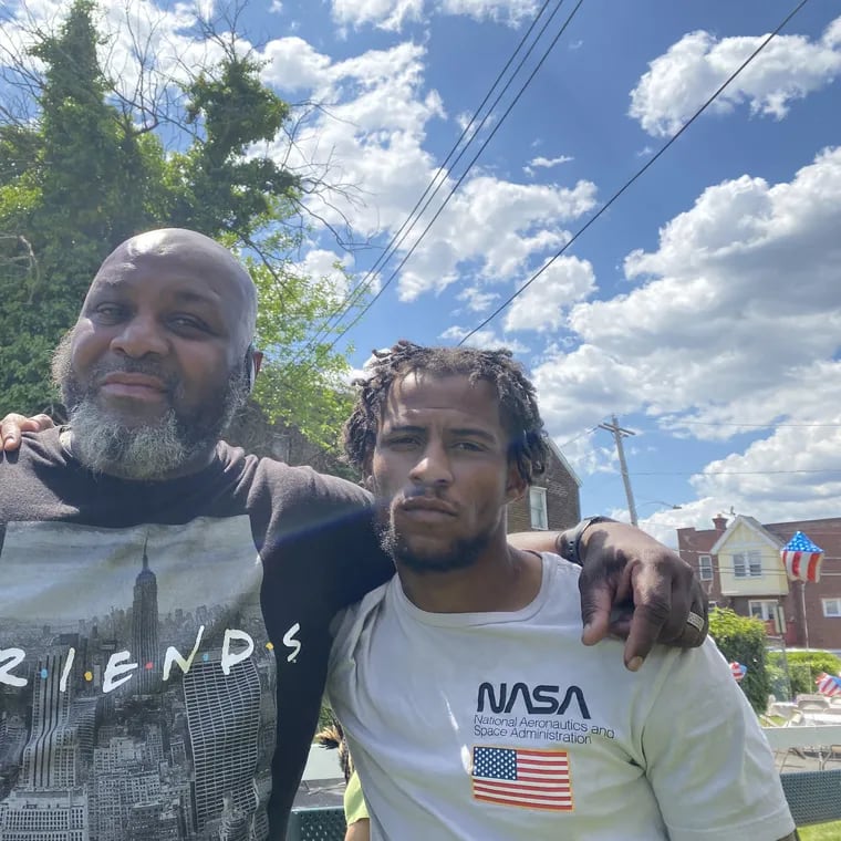 Greg Thompson (left) and Marvel Thornton-Cruz, in May at a Southwest green lot that has been transformed into a memorial park for area residents who have died. Thompson, 60, employs Cruz, 28, in a city-funded landscaping program.