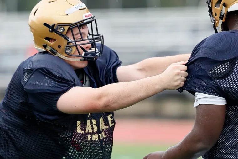 La Salle High School senior Ryan Wills (left) said the team will dedicate "every second" of the season to classmate and teammate Isaiah Turner, who collapsed and died after practice on Friday, Sept. 4.