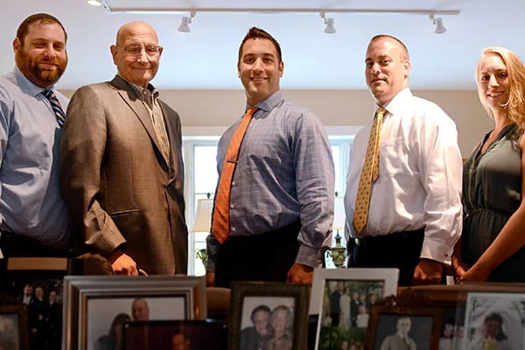 Joseph Levine (jacket) with his triplet sons (from left) Adam, Jonathon, and Brian, and daughter Lindsey. Joseph is being treated for pancreatic cancer.