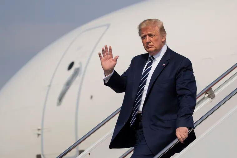 President Donald Trump walks from Air Force One upon arrival at Morristown Municipal Airport, in Morristown, N.J., Friday, July 19, 2019.