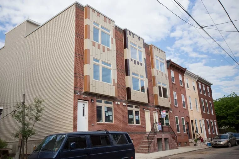 Three newly developed properties on the 1900 block of Ingersoll Street, in Philadelphia, Monday, May 8, 2017. This property was developed and built by Rahil Raza's Raza Properties, which has done 47 small-scale multifamily condo projects and rowhouse rehabs in Point Breeze and North Philadelphia. ( JESSICA GRIFFIN / Staff Photographer)