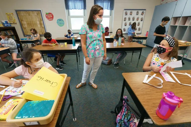 5th grade teacher Torie Layton, with students at Lower Gwynedd Elementary School, where the classrooms are arranged for 6 feet social distancing between students, in Ambler, Pa., Thursday, September 3, 2020.