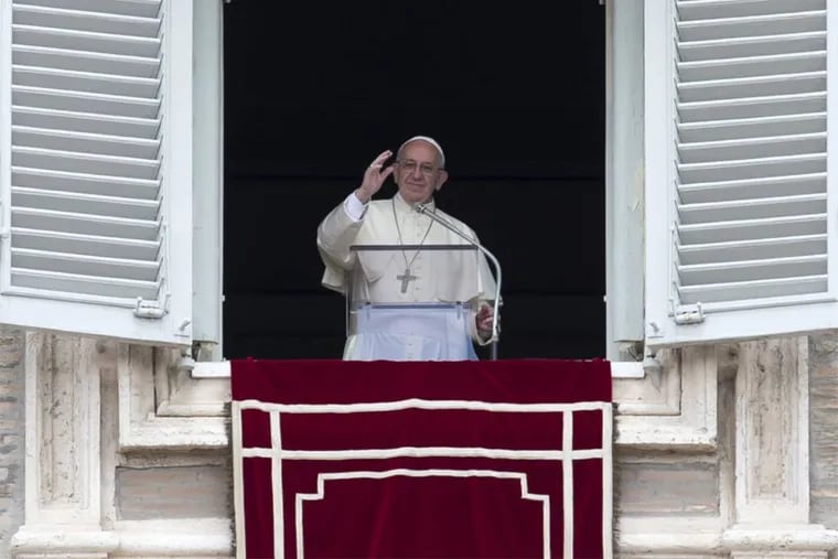 Pope Francis delivers his blessing during the Regina Coeli prayer from his studio's window overlooking St. Peter's Square, at the Vatican, Sunday, May 1,  2016.