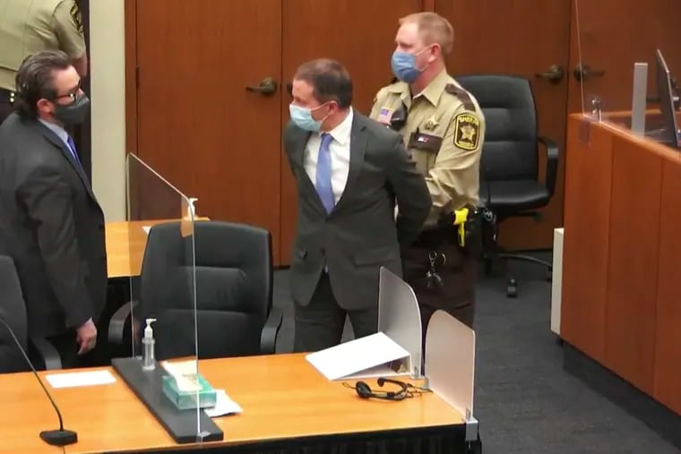 In this image from video, former Minneapolis police Officer Derek Chauvin, center, is taken into custody as his attorney, Eric Nelson, left, looks on, after the verdicts were read at Chauvin's trial for the 2020 death of George Floyd.