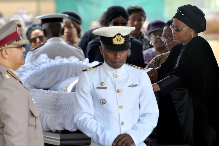 Nelson Mandela's widow, Graca Machel, attends a morning viewing as her husband lies in state at the Union Buildings in Pretoria. &quot;I wish I can say to him, 'Wake up and don't leave us,' &quot; said a mourner.