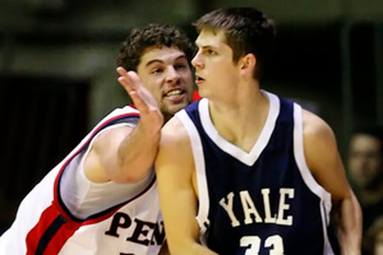 Penn&#0039;s Mark Zoller pressures Caleb Holmes. Zoller had 22 points, along with 17 rebounds, six assists and four blocked shots.