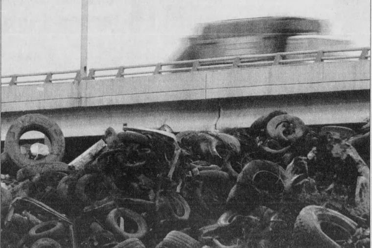 Motorists drive on the reopened section of I-95 about a week after it was closed due to damage from a tire fire in March 1996.