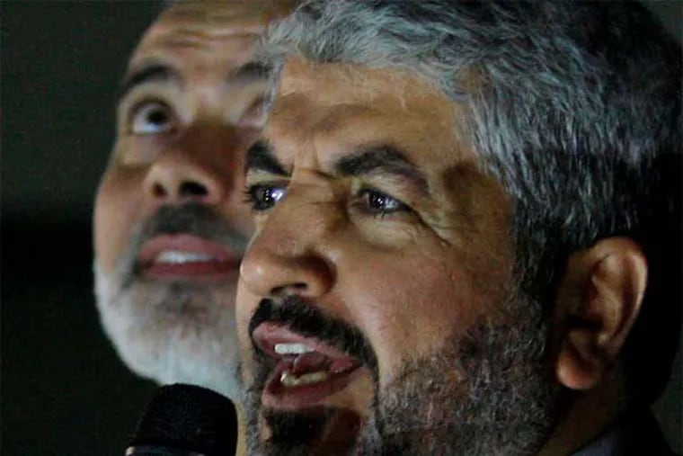 Hamas leader Khaled Mashaal spoke over the weekend at the Gaza home of a family who lost 10 members in an Israeli strike (AP Photo / Pool).