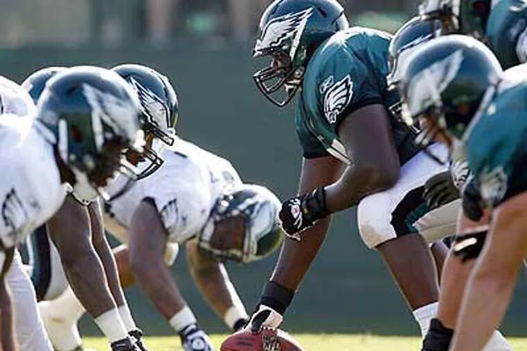 Despite a potential backup role, Jamaal Jackson (center) is one of the Eagles' leaders. (Yong Kim/Staff Photographer)