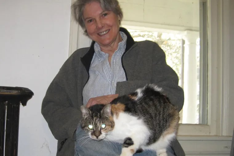 Kate Decker, with her cat.