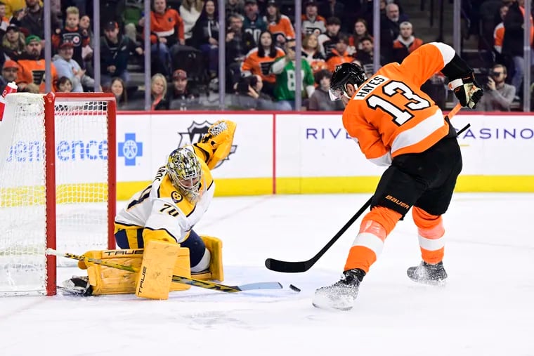 Kevin Hayes dangles around Nashville Predators goalie Juuse Saros to score the Flyers' opening goal on Saturday.