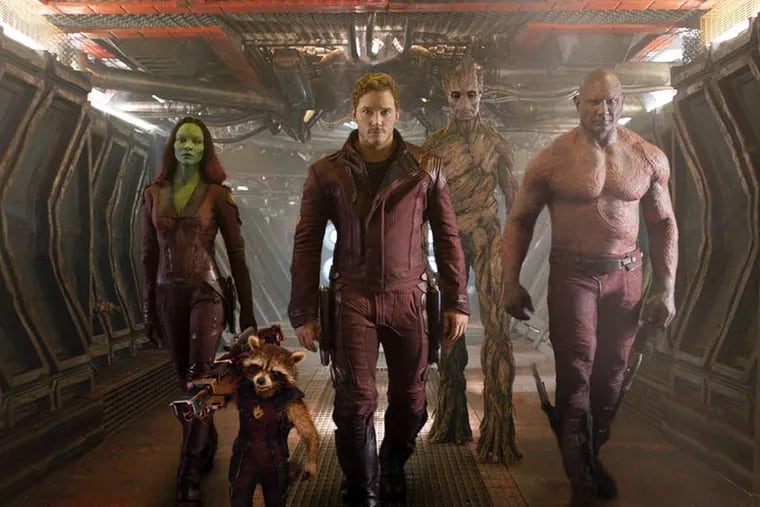 Zoe Saldana, Rocket Racoon (Bradley Cooper), Chris Pratt, Groot (Vin Diesel), and Dave Bautista in &quot;Guardians of the Galaxy.&quot;