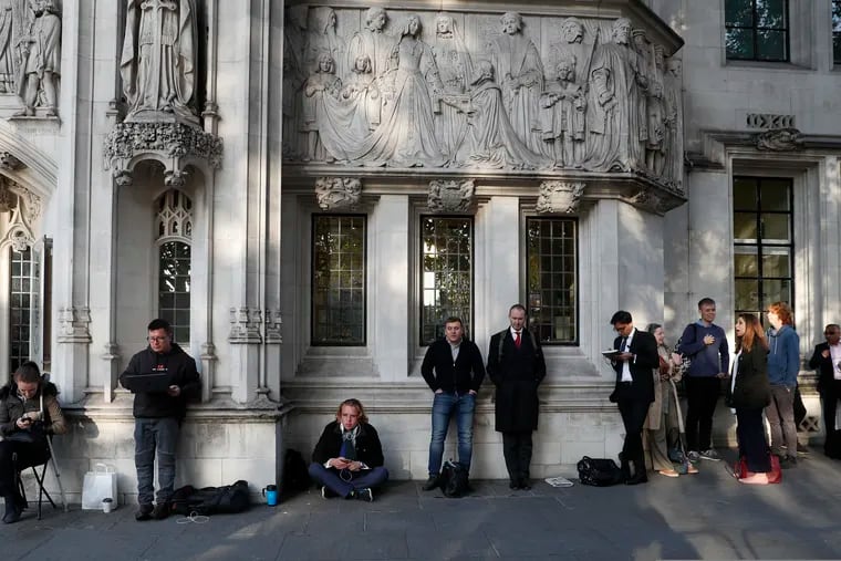 Members of the public queue up for a seat at The Supreme Court in London, Thursday, Sept. 19, 2019. The Supreme Court is set to decide whether Prime Minister Boris Johnson broke the law when he suspended Parliament on Sept. 9, sending lawmakers home until Oct. 14 — just over two weeks before the U.K. is due to leave the European Union.