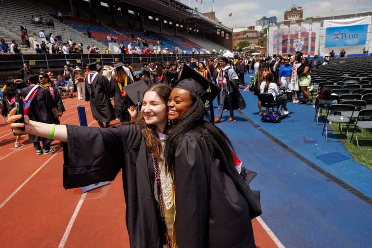 Bianca Yama annd Ruqaiyyah Lucas-Caldwell celebrate graduation with a selfie at the end of the 2024 graduation at the University of Pennsylvania held at Franklin Field on Monday.