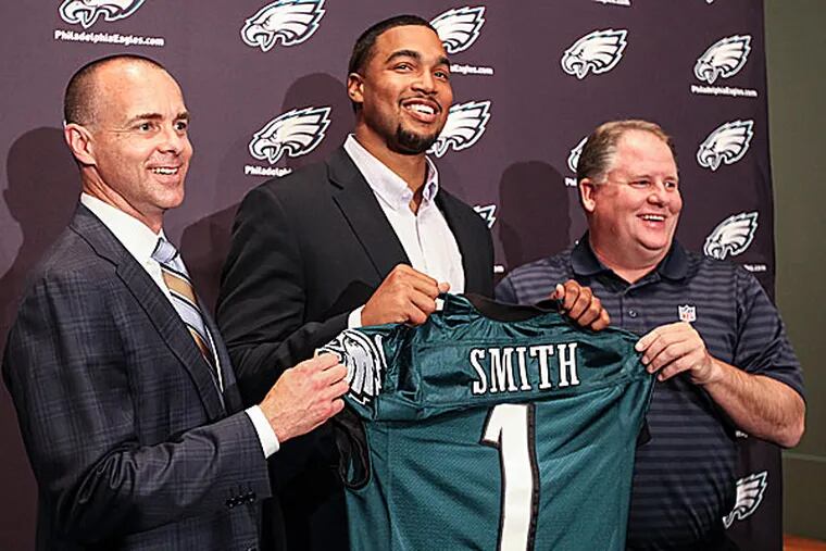 Eagles president Don Smolenski, 2014 first round pick Marcus Smith and head coach Chip Kelly. (Steven M. Falk/Staff Photographer)