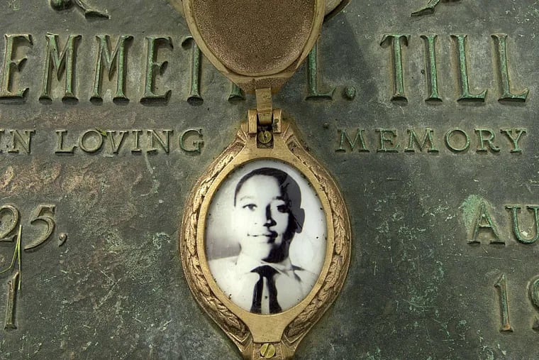FILE – In this May 4, 2005 file photo, Emmett Till's photo is seen on his grave marker in Alsip, Ill. The FBI announced Wednesday, May 4, 2005, that Till's body will be exhumed to conduct an autopsy, which was never performed, and determine the cause of death. The woman at the center of the trial of Emmett Till's alleged killers has acknowledged that she falsely testified he made physical and verbal threats, according to a new book. Historian Timothy B. Tyson told The Associated Press on Saturday, Jan. 28, 2017, that Carolyn Donham broke her long public silence in an interview with him in 2008. (Robert A. Davis/Chicago Sun-Times via AP)