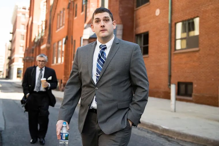 Former East Pittsburgh police officer Michael Rosfeld, charged with homicide in the shooting death of Antwon Rose II, walks to the Dauphin County Courthouse in Harrisburg, Pa., Tuesday, March 12, 2019.
