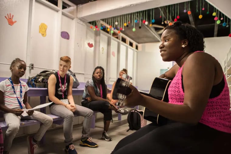 Lafae Duhaney, a student at Florida State University, led a music therapy session in 2018 for a group of girls at Camp Dreamcatcher. The nonprofit is one of dozens that have received grants through the PHL COVID-19 Fund.