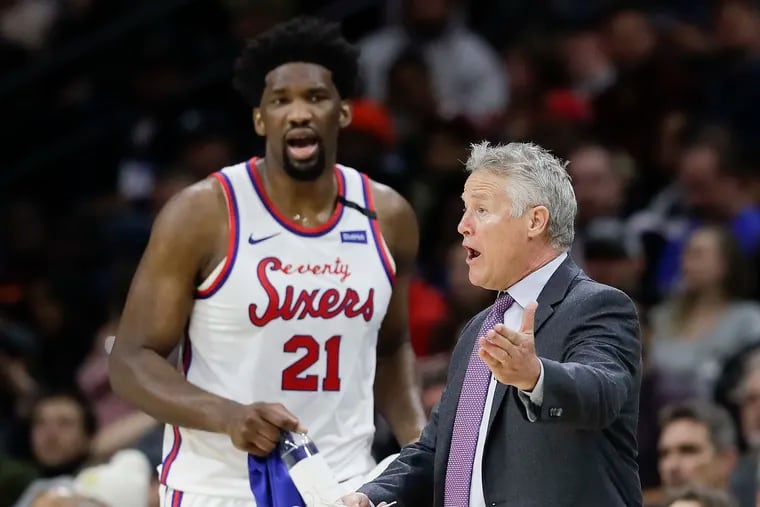 Brett Brown and Joel Embiid together on the bench during the first quarter.